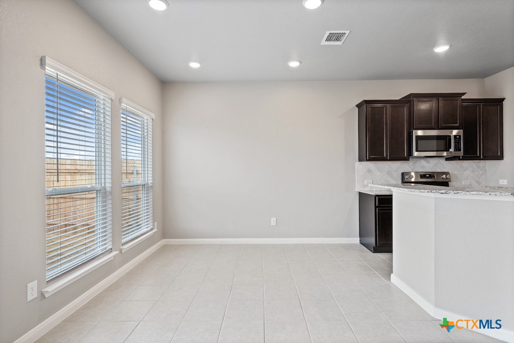 1028 Coriander Road Temple, TX 76501 - Photo 9 of 23 a view of kitchen with microwave and cabinets