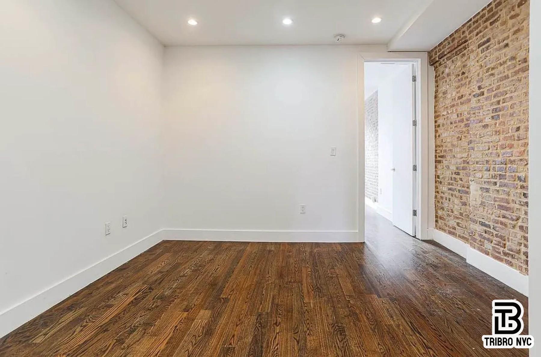 558 Kosciuszko Street, Unit 2R Brooklyn, NY 11221 - Photo 3 of 7 a view of wooden floor in a hallway