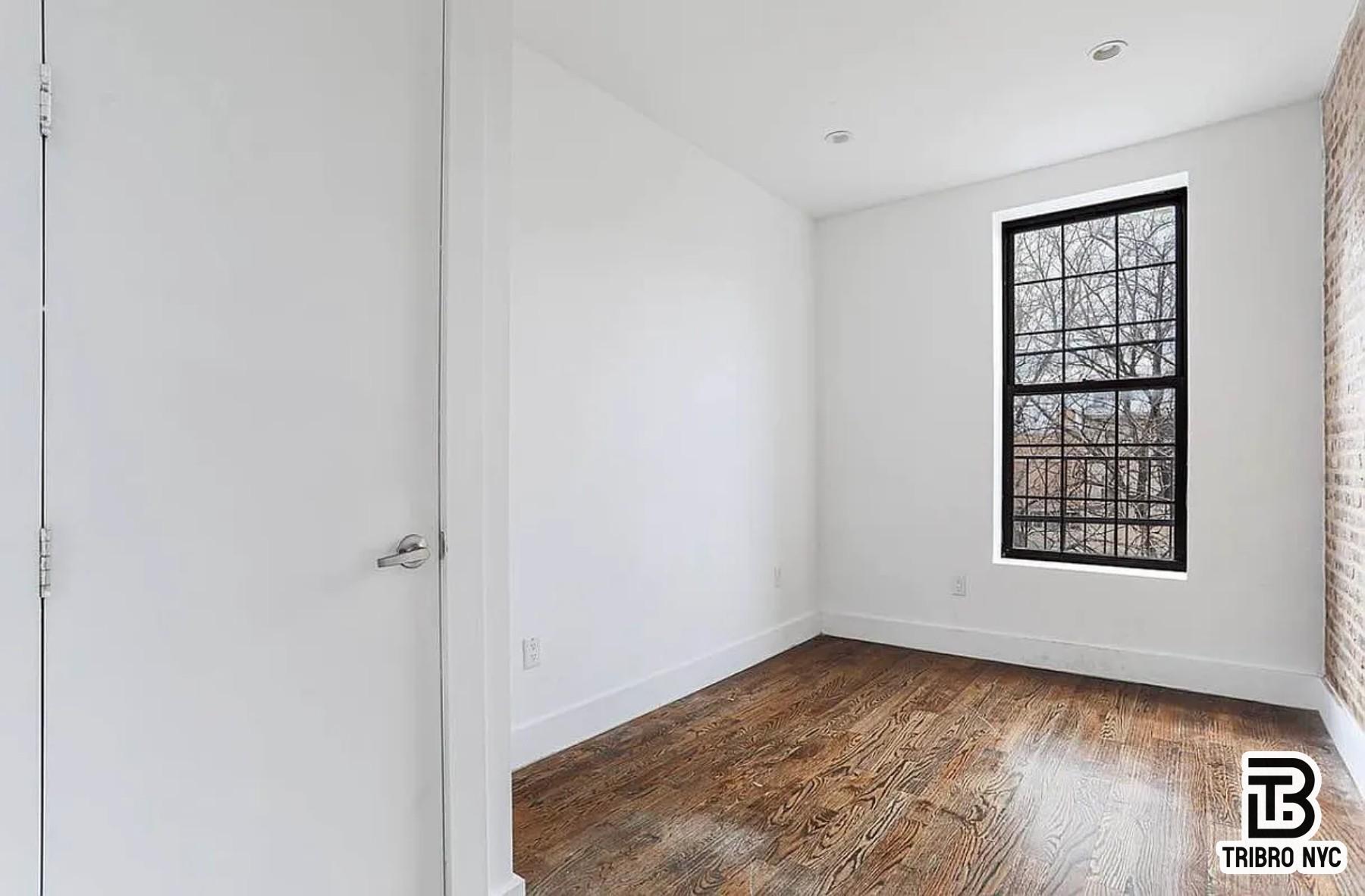 558 Kosciuszko Street, Unit 2R Brooklyn, NY 11221 - Photo 4 of 7 an empty room with windows