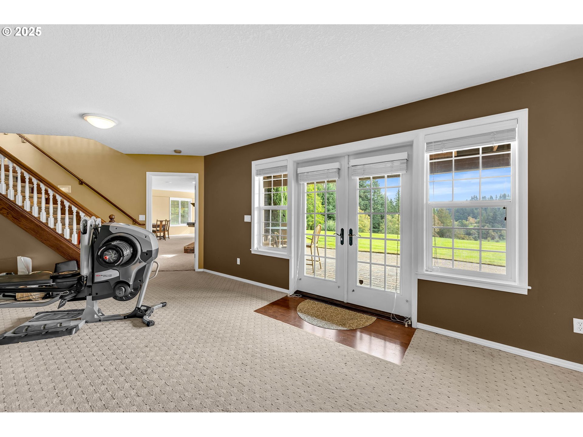 3901 Northwest 150th Circle Vancouver, WA 98685 - Photo 35 of 48 a room with gym equipment and a large window