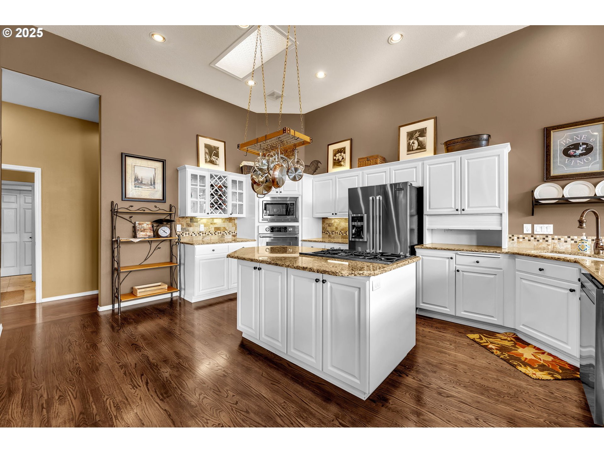 3901 Northwest 150th Circle Vancouver, WA 98685 - Photo 10 of 48 a kitchen with stainless steel appliances granite countertop a stove and cabinets