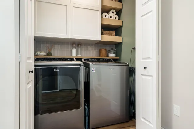 a room with furniture a wooden floor and a book shelf