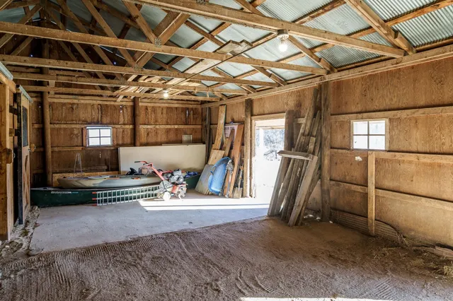 a view of a house with a patio and a yard