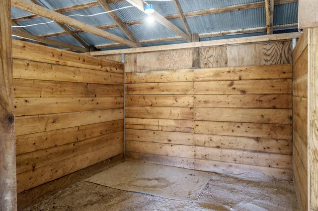 a view of entryway with a floor to ceiling window and wooden floor