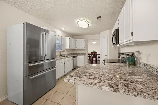 $330,000 | 7636 Misty Ridge Drive North, Fort Worth, TX 76137