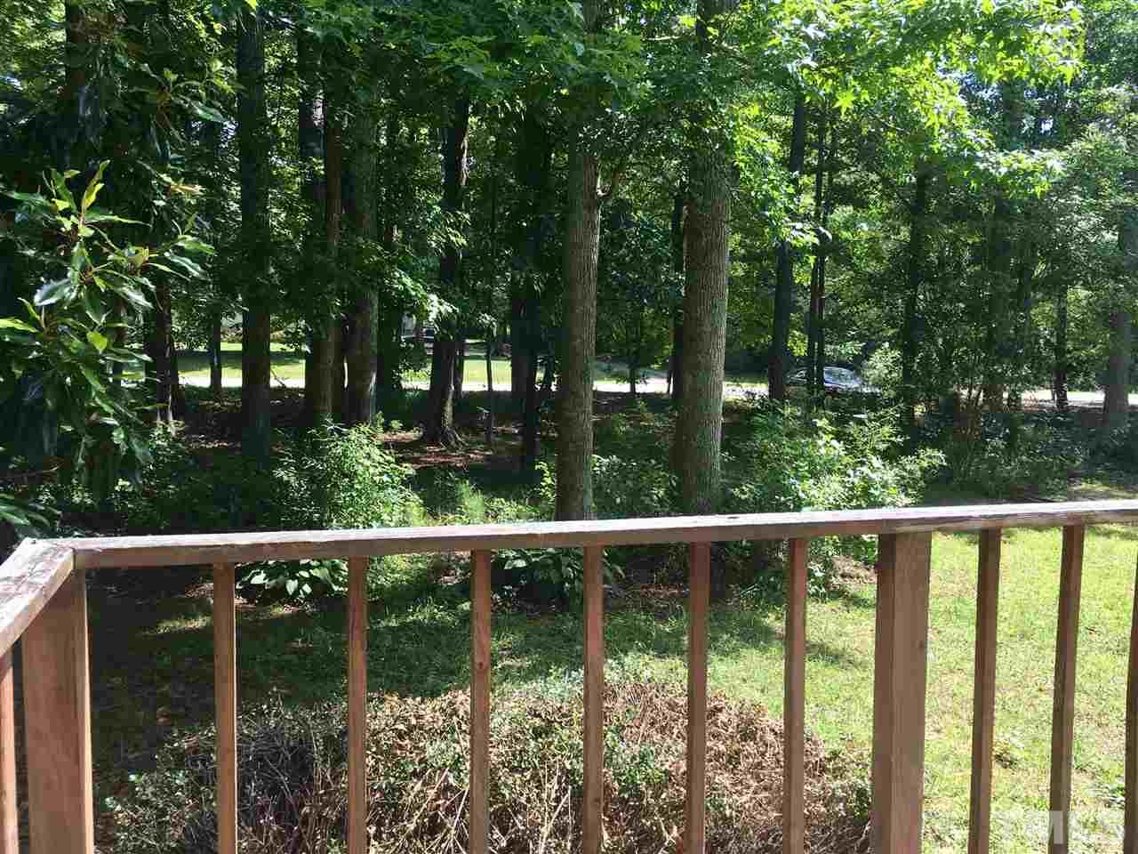 1612 Ridge Road Zebulon, NC 27597 - Photo 16 of 17 a view of a balcony with trees