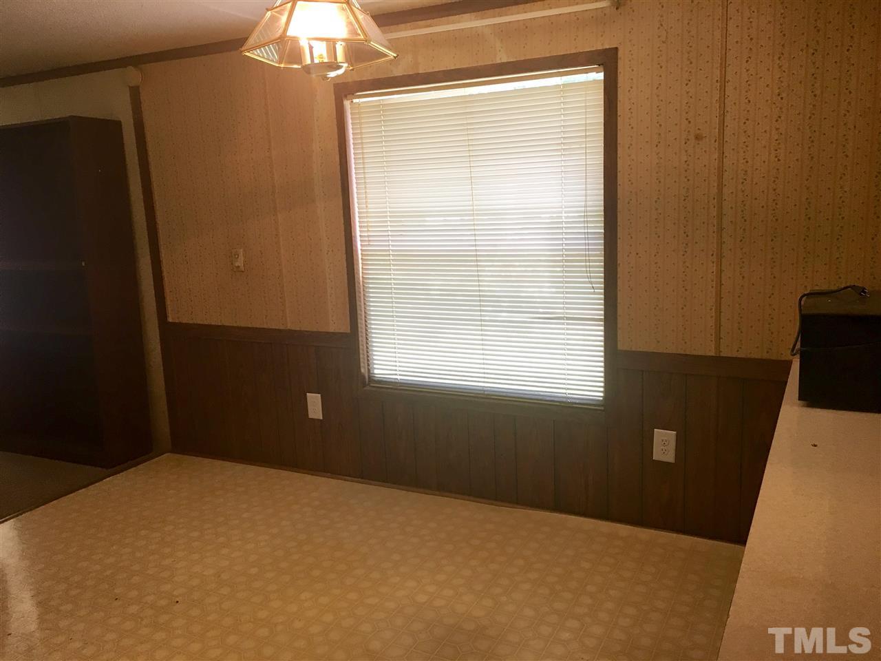 1612 Ridge Road Zebulon, NC 27597 - Photo 6 of 17 a bedroom with a bed and a window