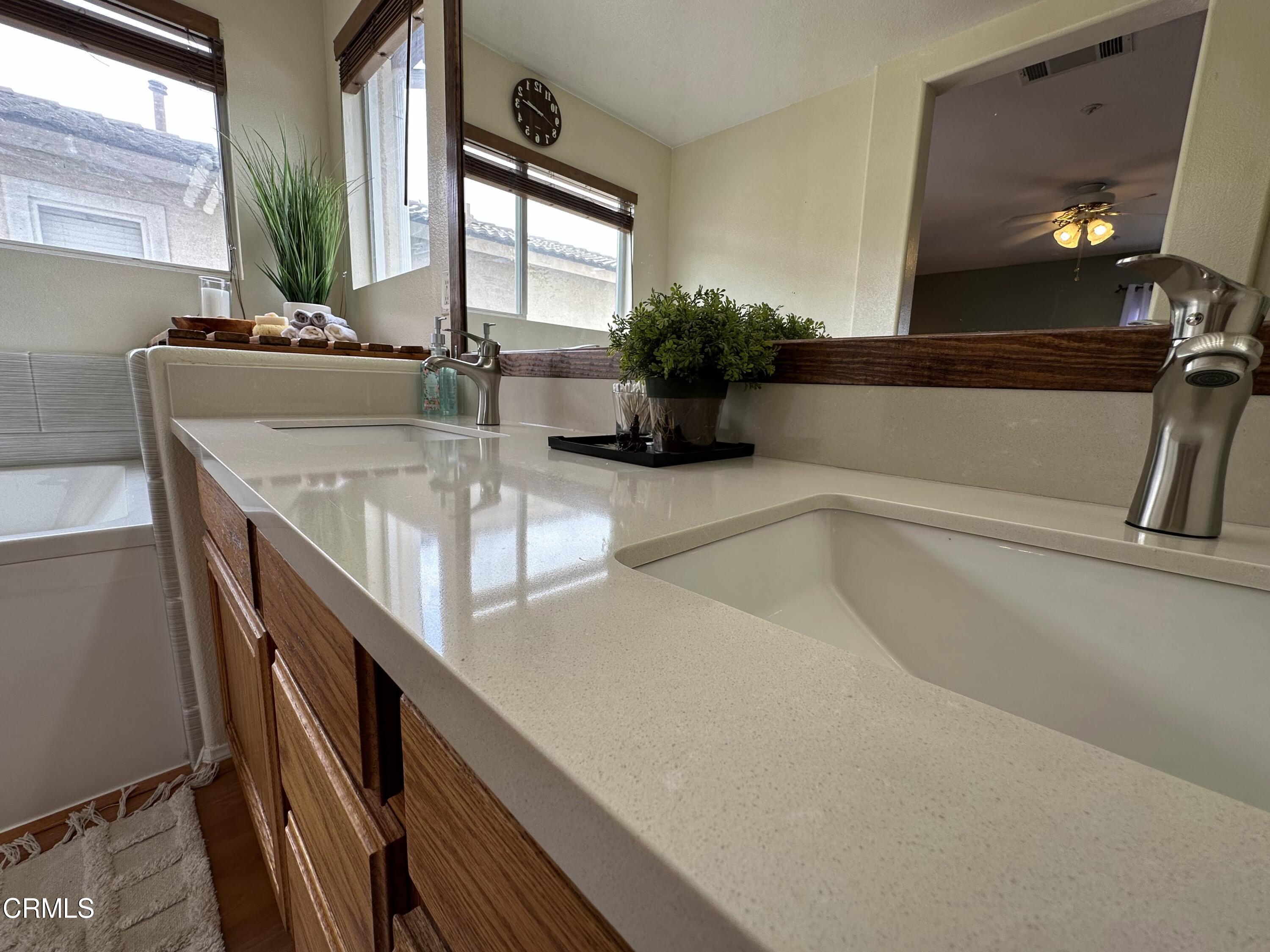 803 Noontide Way Oxnard, CA 93035 - Photo 15 of 26 a bathroom with a sink a vanity and a mirror
