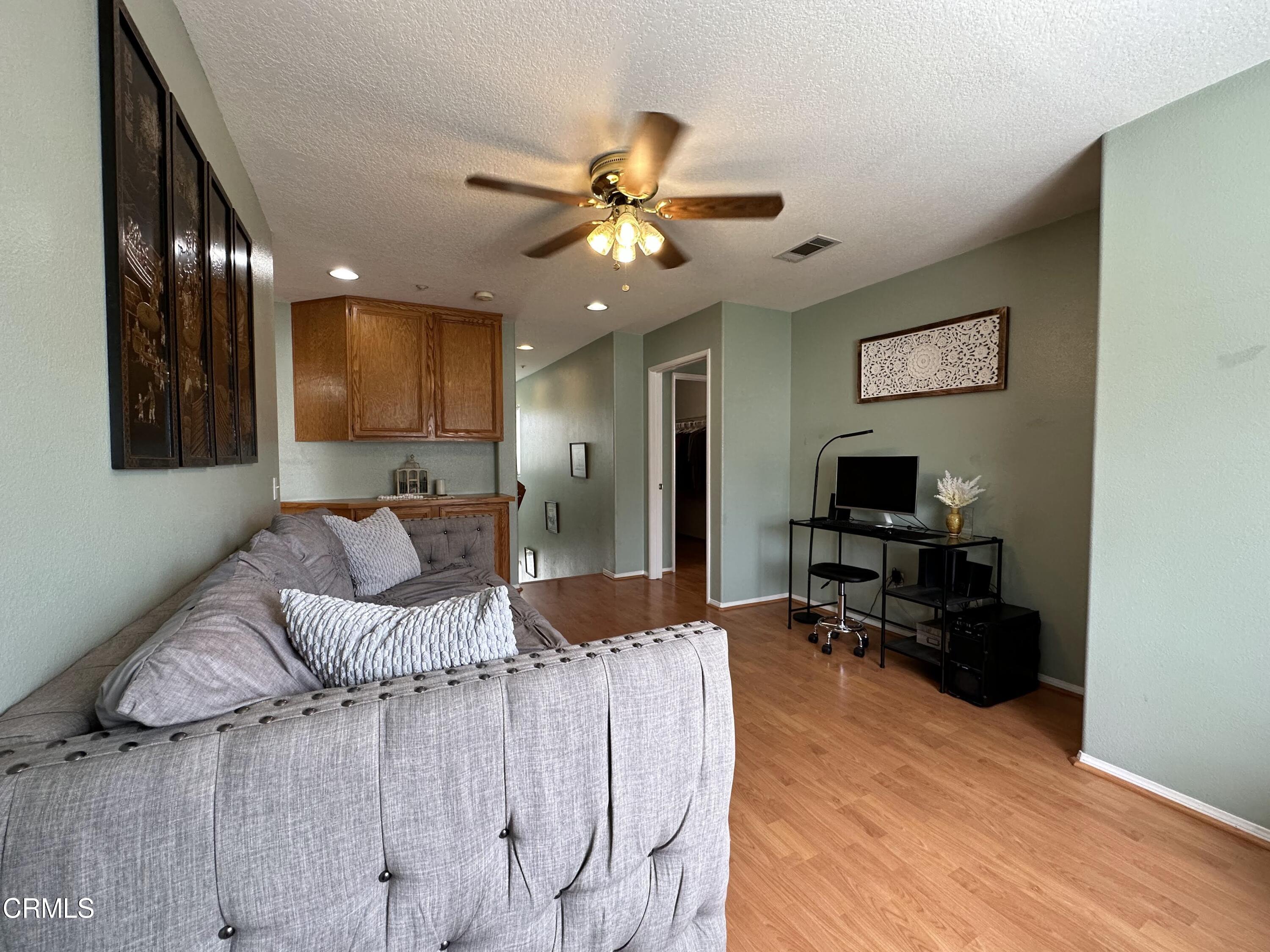 803 Noontide Way Oxnard, CA 93035 - Photo 19 of 26 a living room with furniture and a flat screen tv