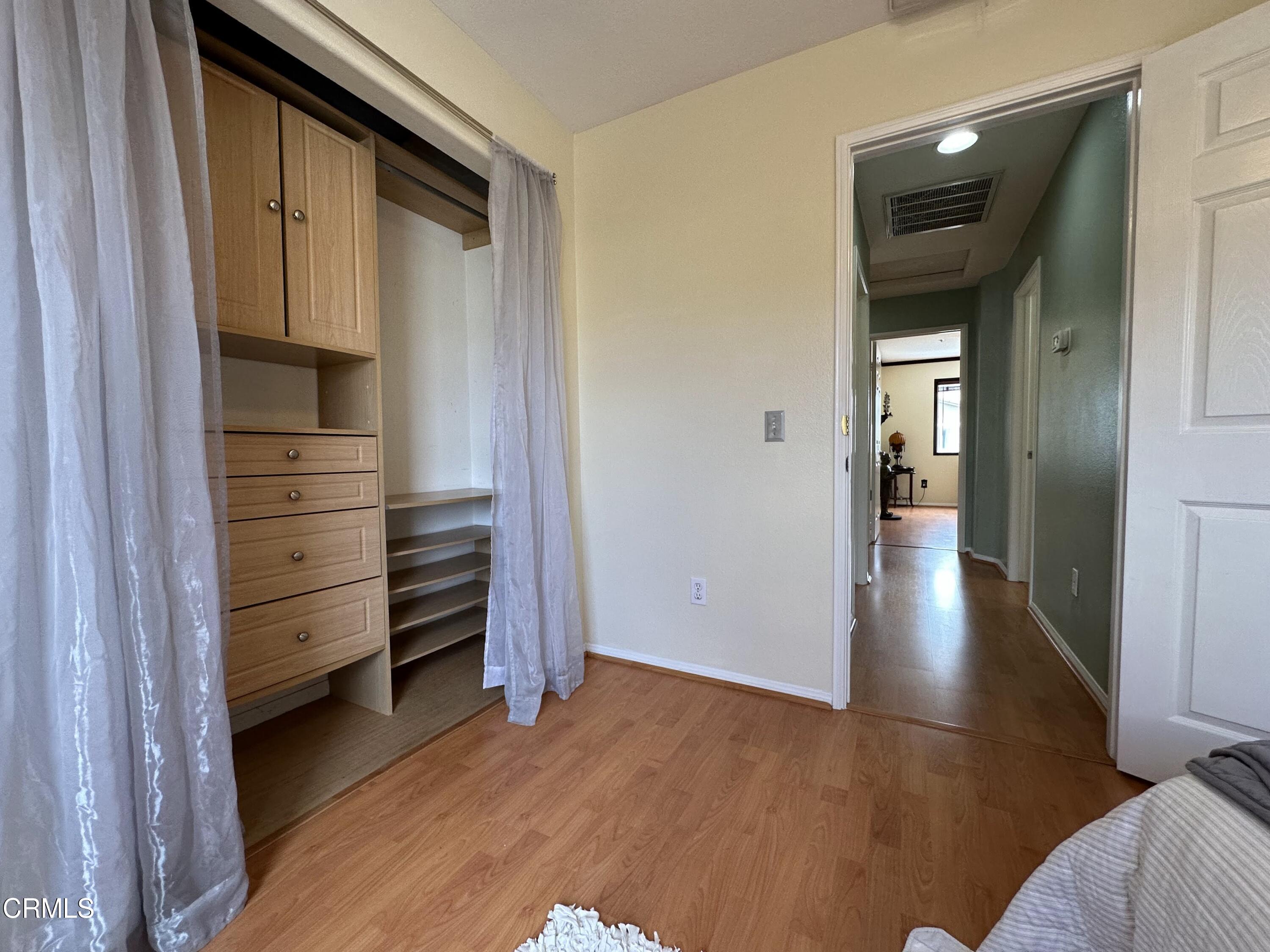 803 Noontide Way Oxnard, CA 93035 - Photo 26 of 26 a view of a hallway with wooden floor and closet