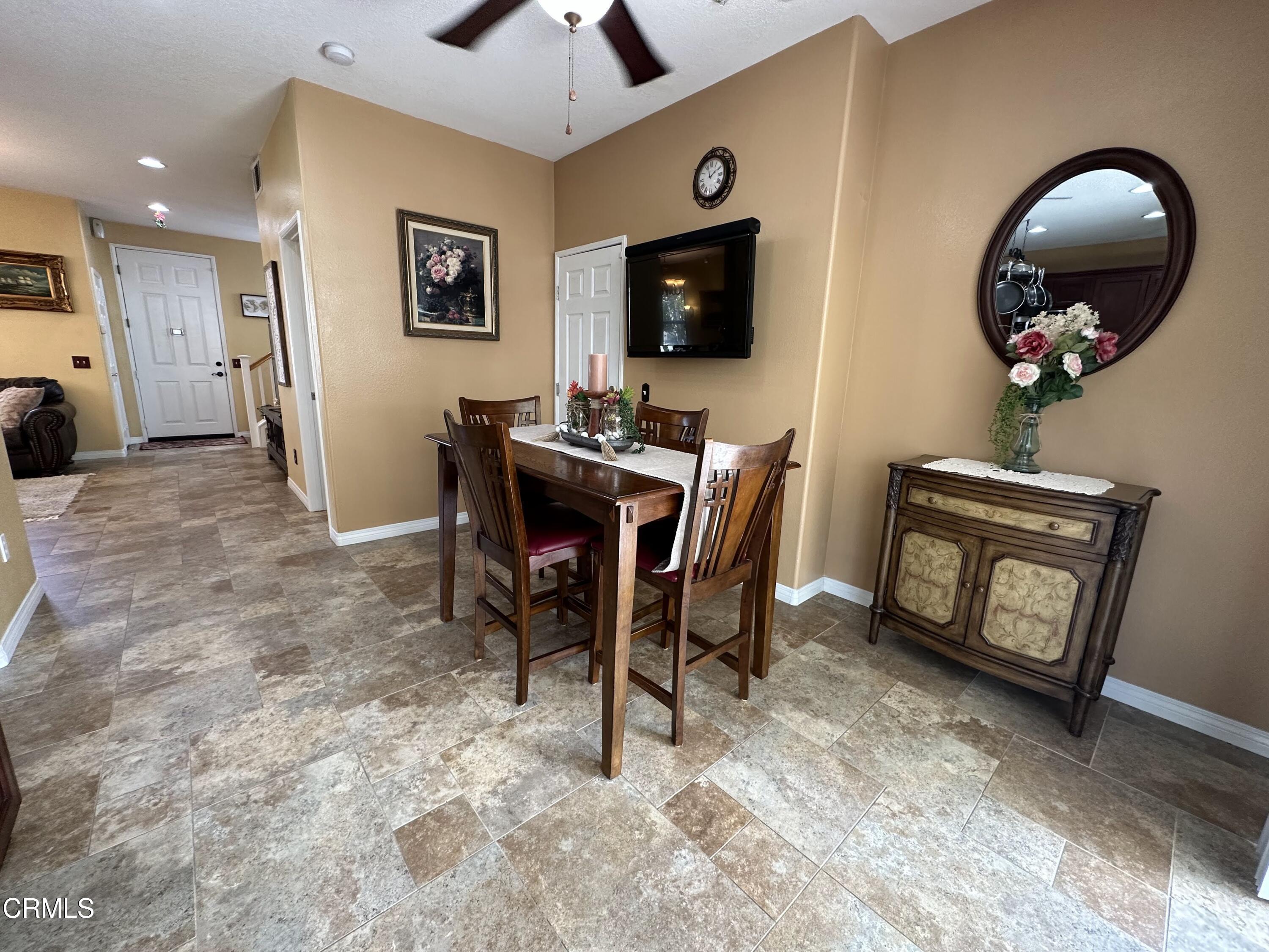 803 Noontide Way Oxnard, CA 93035 - Photo 6 of 26 a view of a livingroom with furniture and a flat screen tv