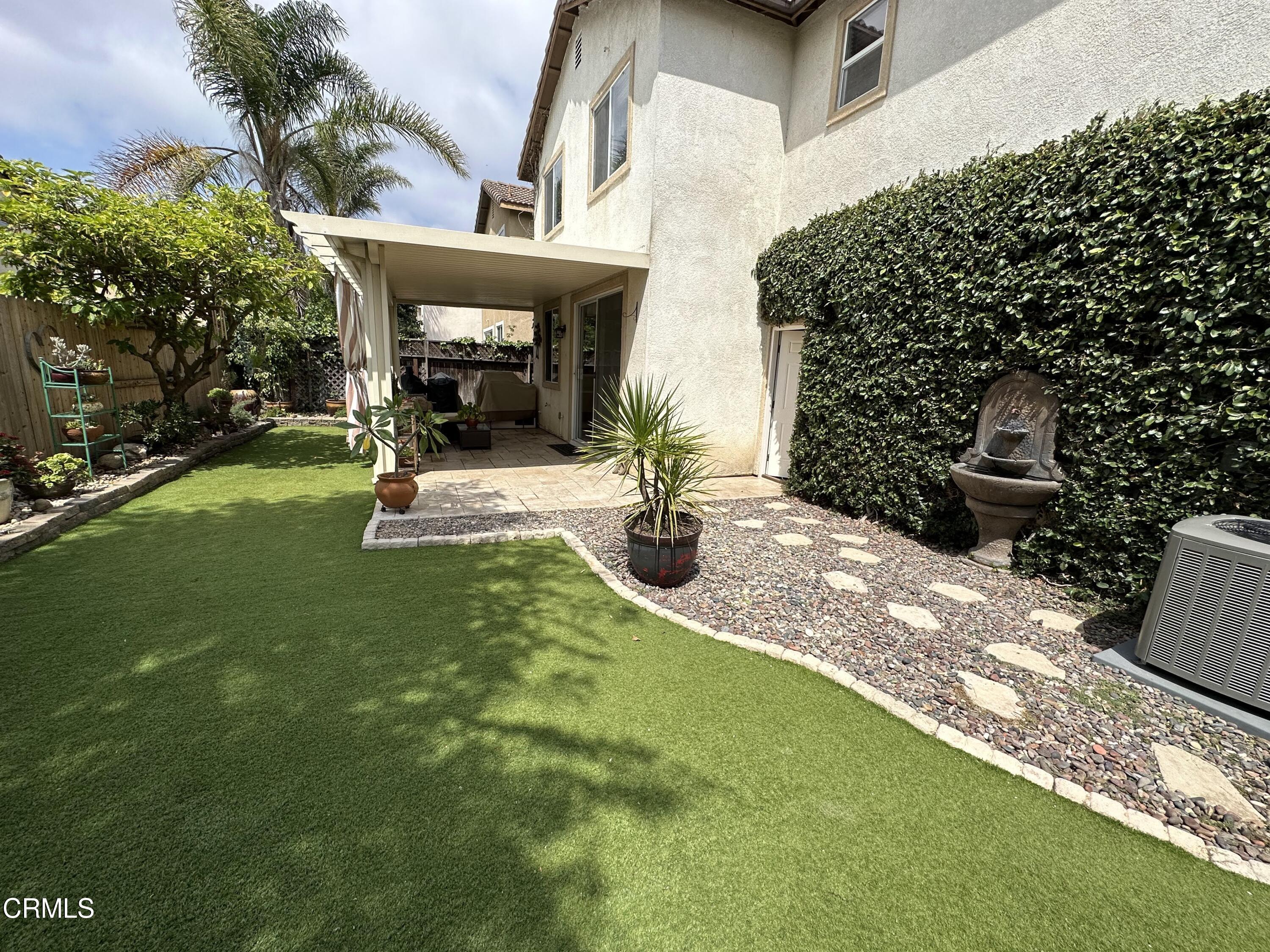 803 Noontide Way Oxnard, CA 93035 - Photo 10 of 26 a view of a patio with table and chairs and potted plants