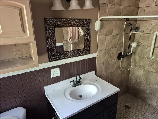 a bathroom with a sink and a mirror