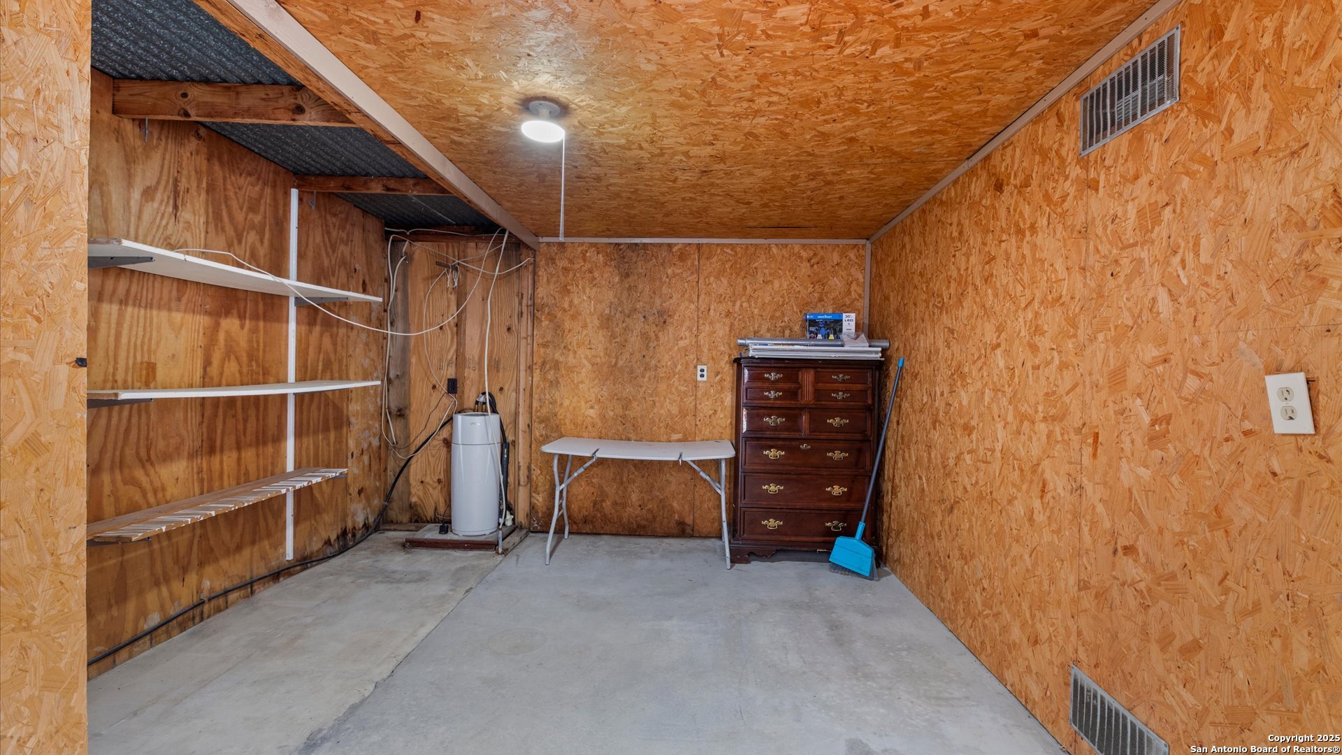 6750 Crown Ridge San Antonio, TX 78239 - Photo 23 of 31 a view of walk in closet with clothes