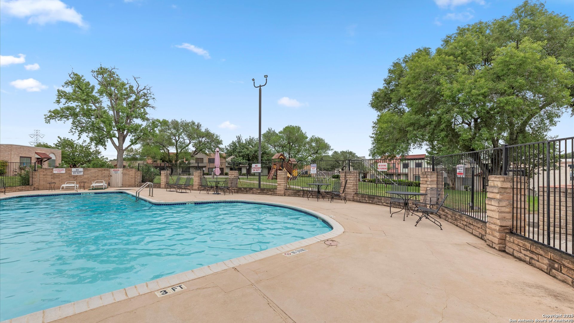 6750 Crown Ridge San Antonio, TX 78239 - Photo 24 of 31 a view of a swimming pool with a sitting area