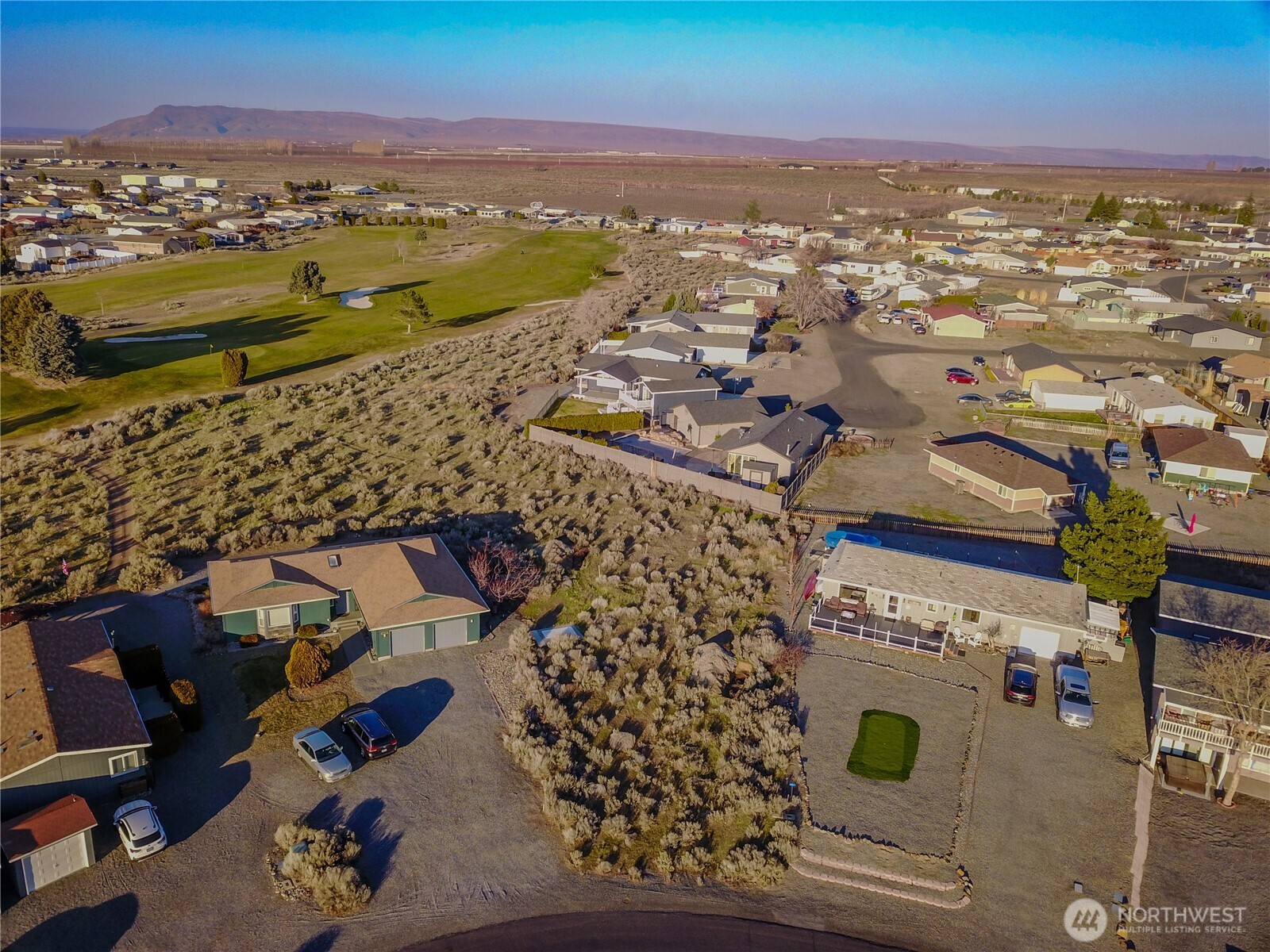 416 Autumn Loop Mattawa, WA 99349 - Photo 9 of 13 an aerial view of residential houses with outdoor space