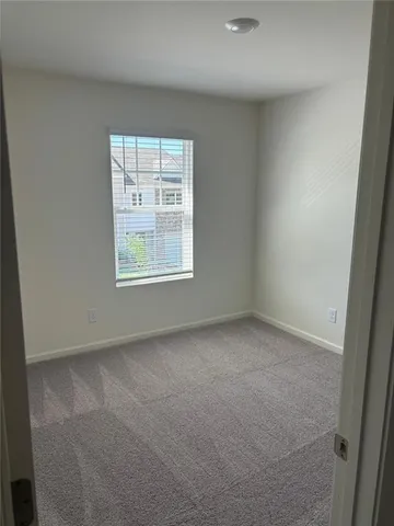 a view of a window in an empty room