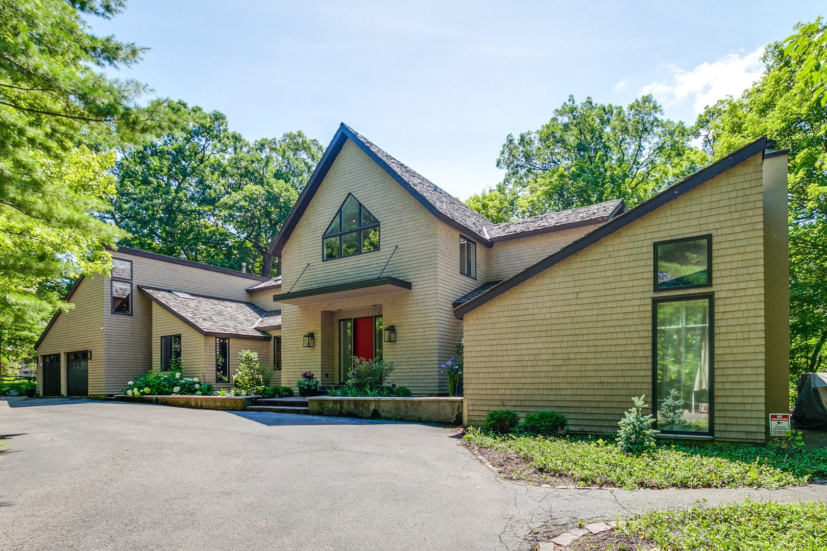 1055 Ringwood Road Lake Forest, IL 60045 - Photo 1 of 59 a front view of a house with a yard and garage