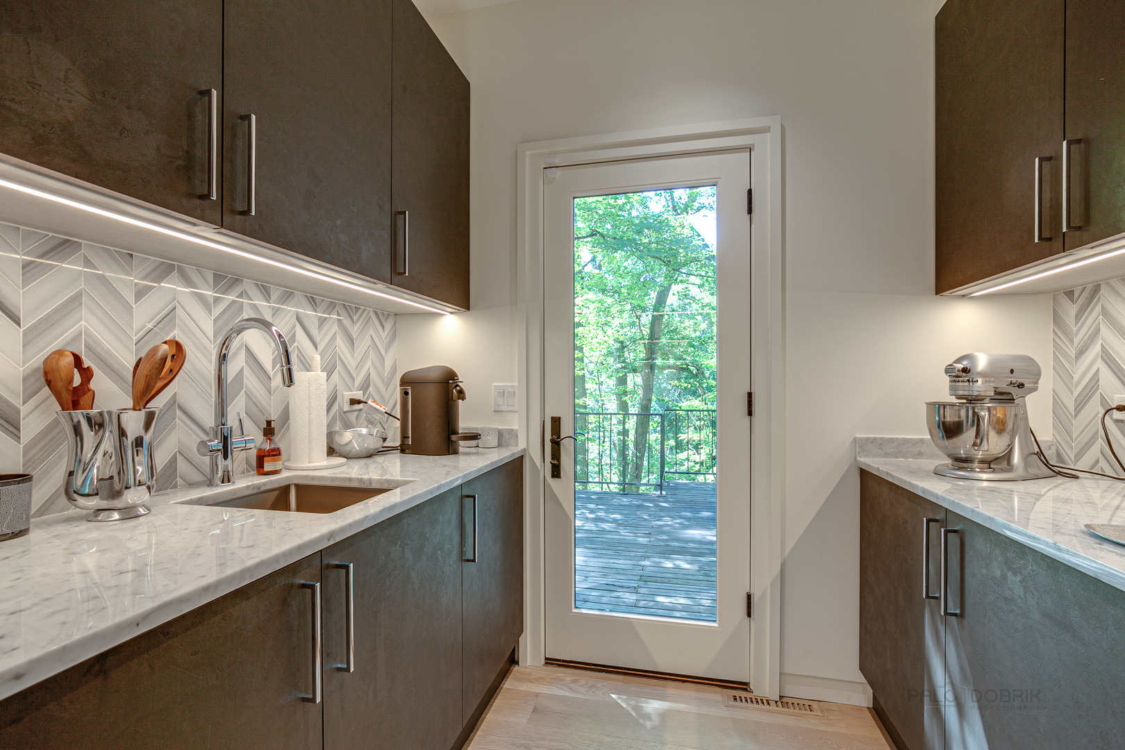 1055 Ringwood Road Lake Forest, IL 60045 - Photo 14 of 59 a kitchen with stainless steel appliances granite countertop a sink and a wooden cabinets