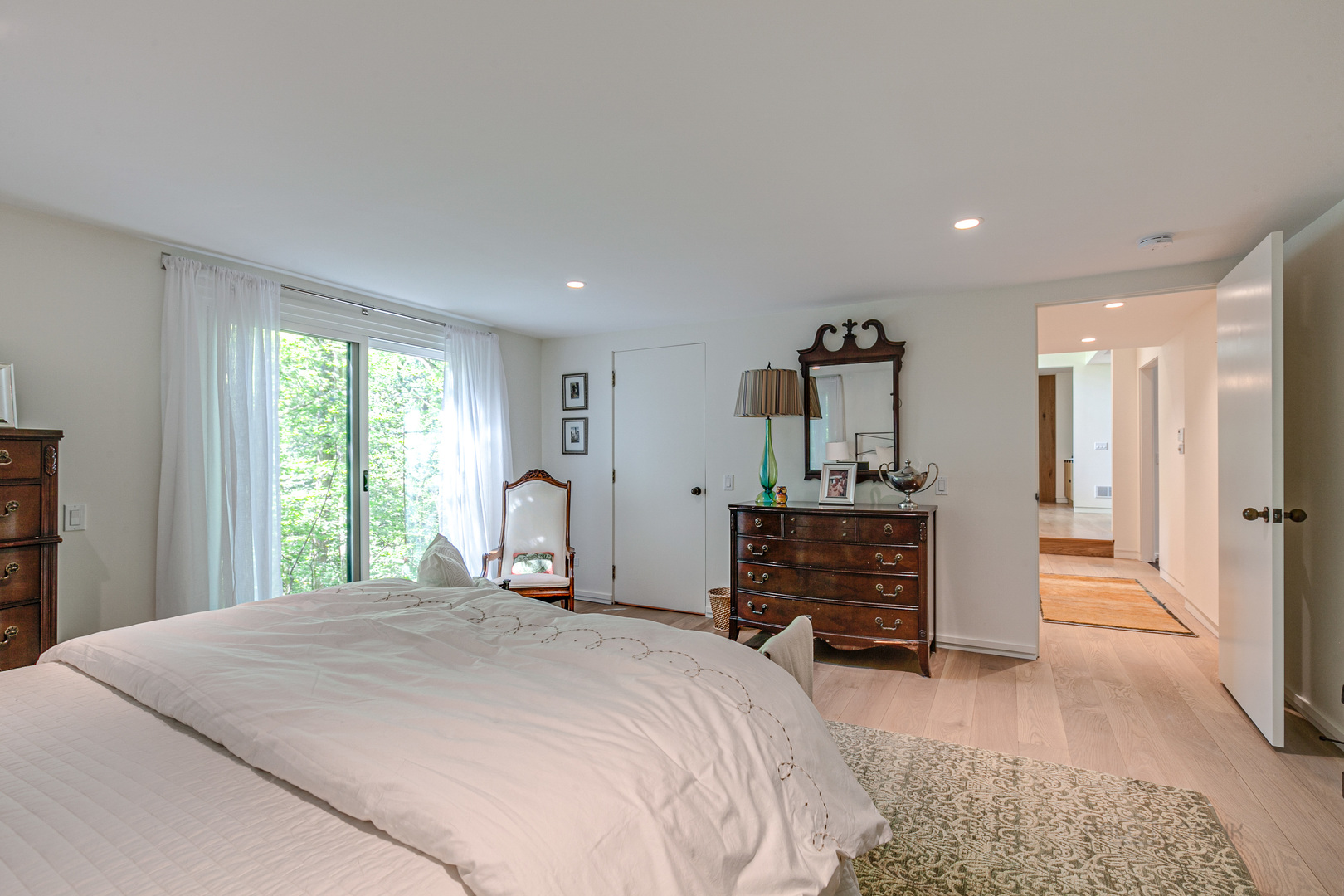1055 Ringwood Road Lake Forest, IL 60045 - Photo 23 of 59 a bedroom with a bed and a dresser