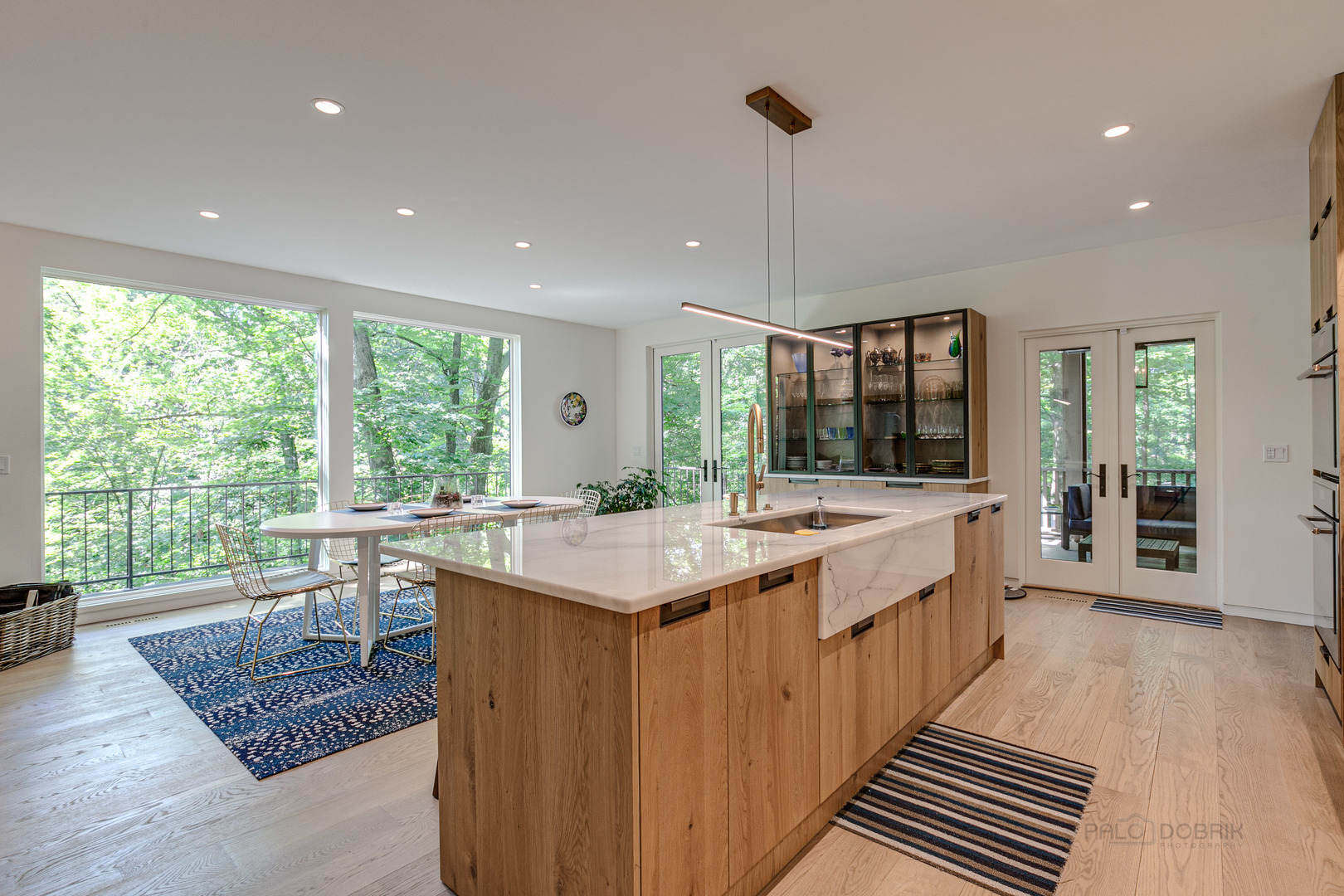 1055 Ringwood Road Lake Forest, IL 60045 - Photo 4 of 59 a large kitchen with kitchen island a large island in it