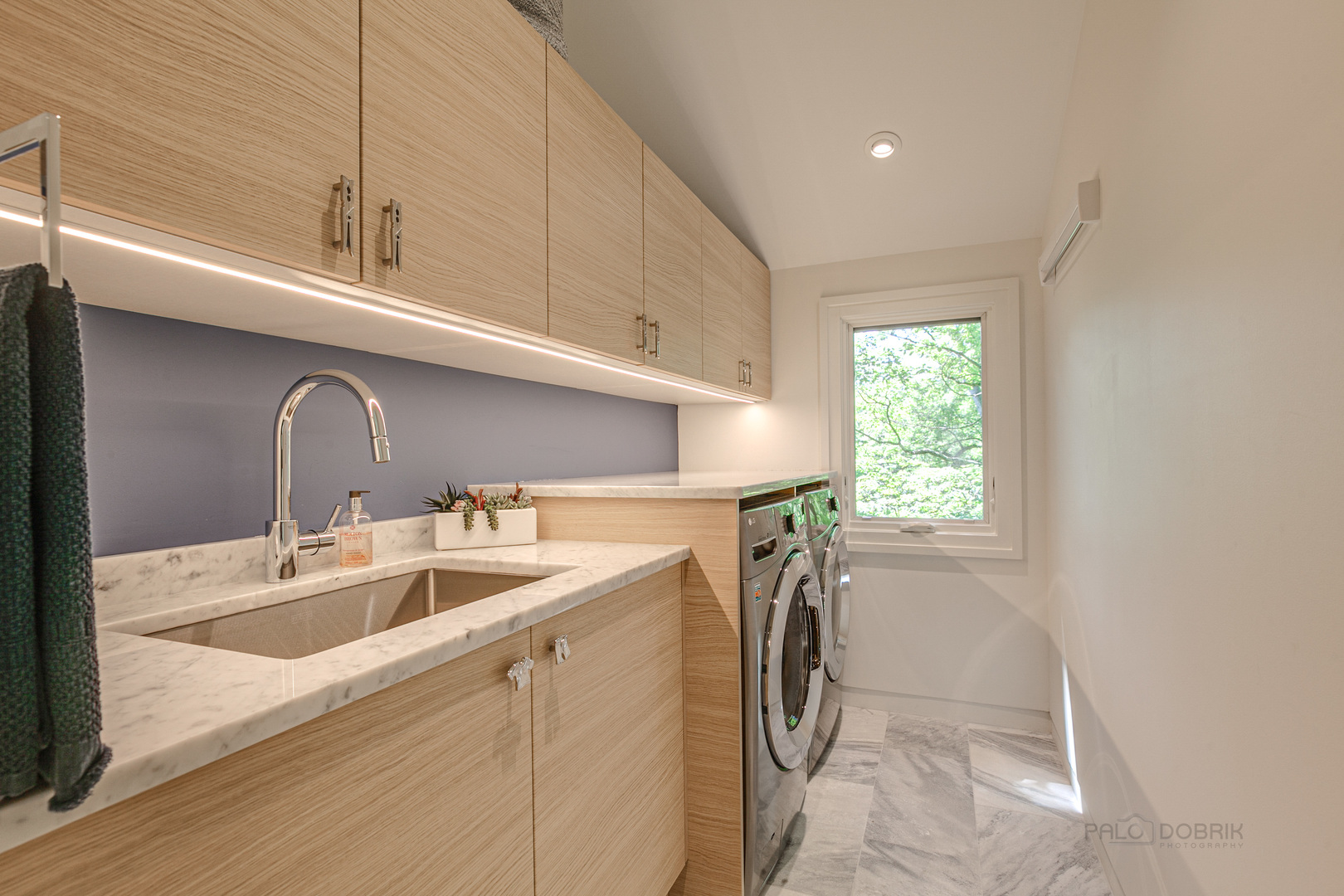 1055 Ringwood Road Lake Forest, IL 60045 - Photo 37 of 59 a kitchen with a sink a washer and dryer