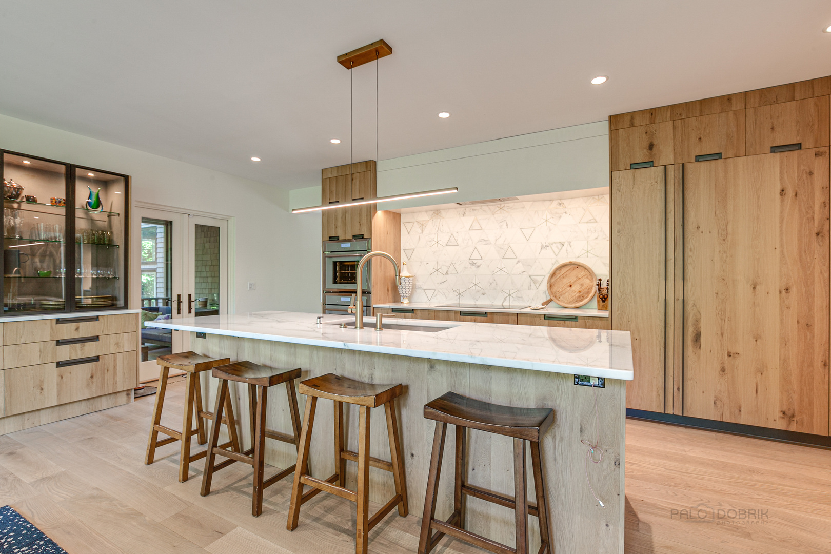 1055 Ringwood Road Lake Forest, IL 60045 - Photo 5 of 59 a kitchen with a table chairs refrigerator and stove