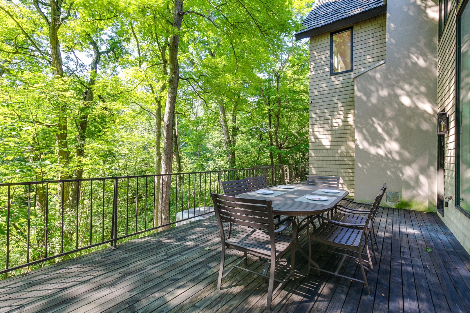 1055 Ringwood Road Lake Forest, IL 60045 - Photo 50 of 59 a view of a balcony with table and chairs and wooden floor