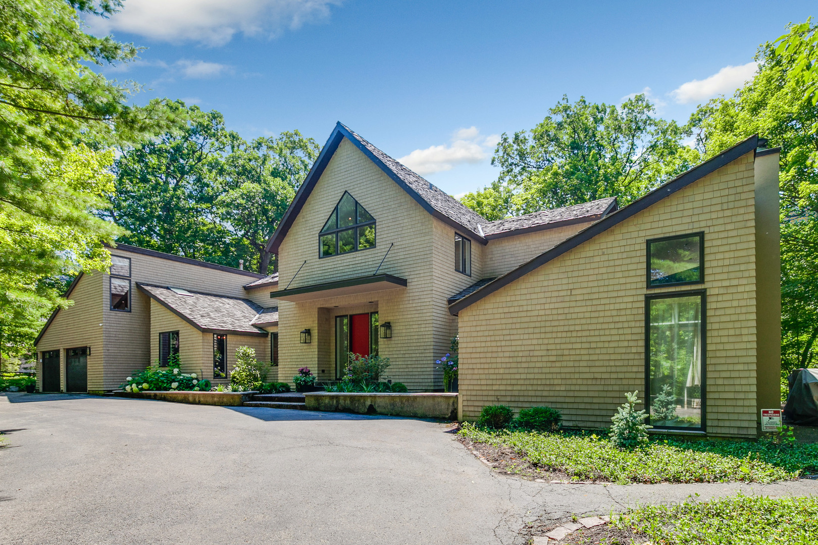 1055 Ringwood Road Lake Forest, IL 60045 - Photo 58 of 59 a front view of a house with a yard and garage