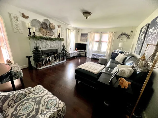a bedroom with a bed window and a fireplace