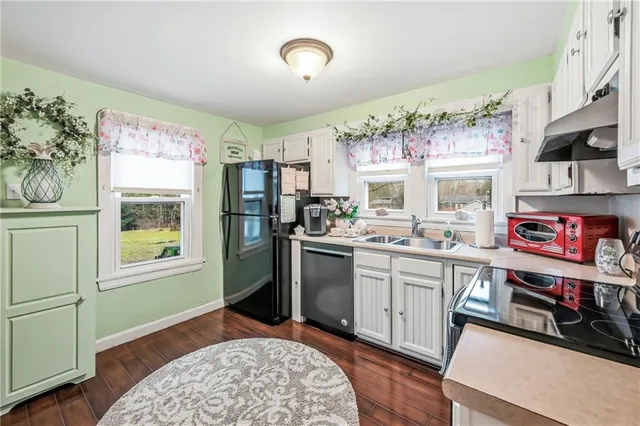 a living room with furniture fireplace and flat screen tv