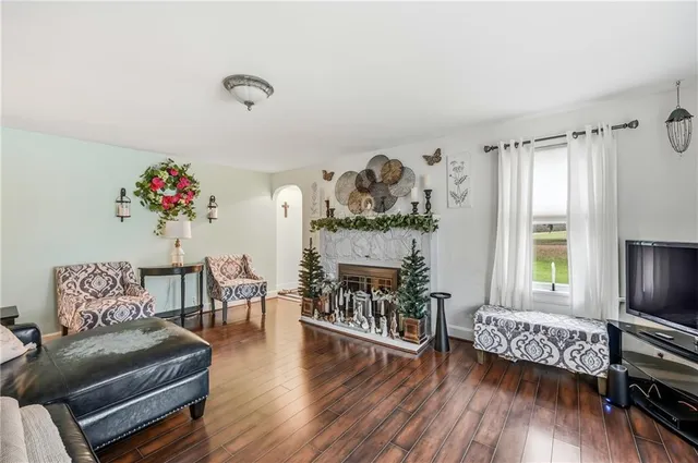 a bedroom with a bed and flat screen tv