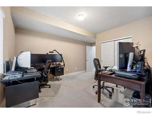 a workspace with furniture and gym equipment