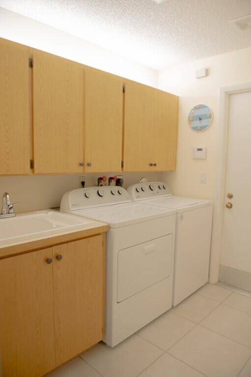 114 Beach Summit Court Jupiter, FL 33477 - Photo 32 of 32 a bathroom with a sink and a mirror