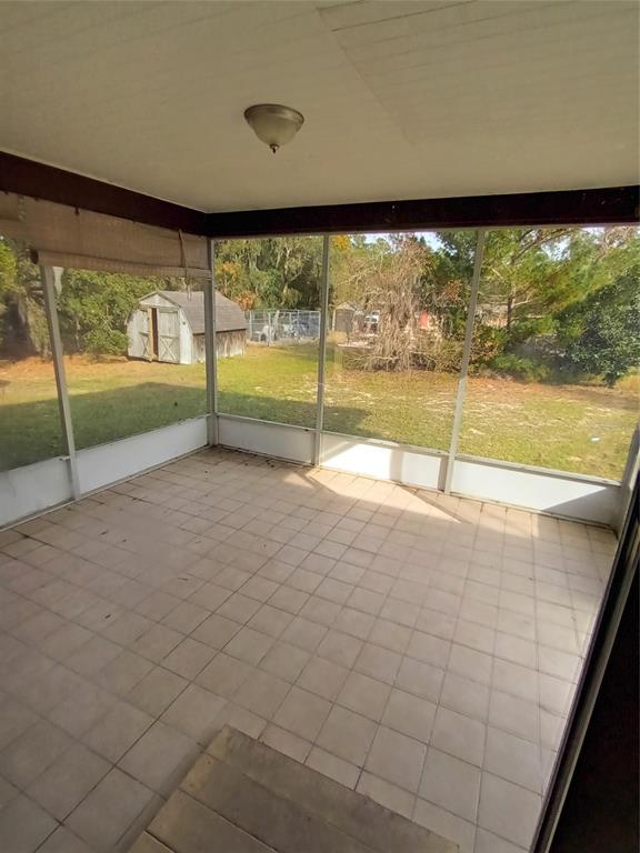 10585 North Spaulding Drive Citrus Springs, FL 34433 - Photo 16 of 18 wooden view of an empty room with a large window