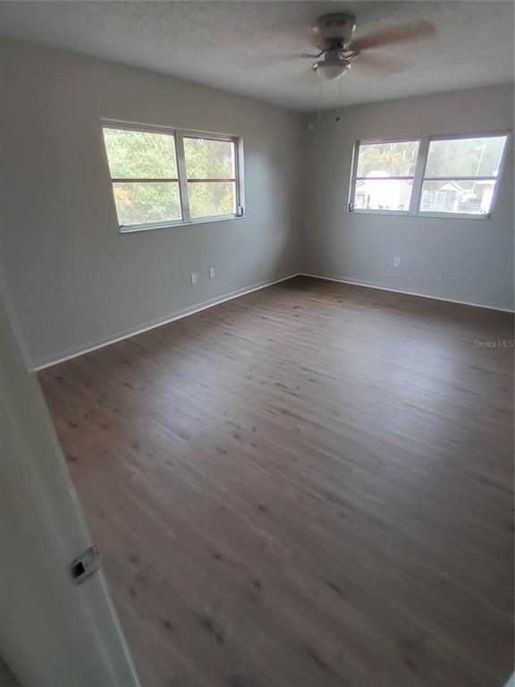 10585 North Spaulding Drive Citrus Springs, FL 34433 - Photo 10 of 18 an empty room with a empty space and windows