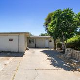 a backyard of a house with yard and garage