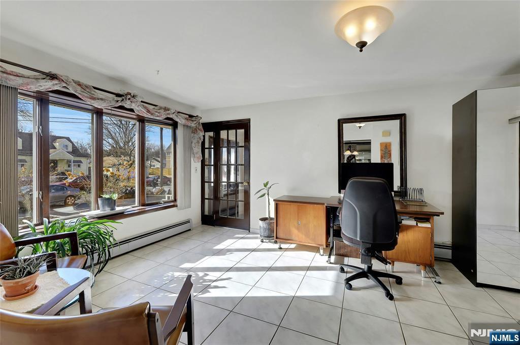4 Highfield Court Wayne, NJ 07470 - Photo 12 of 49 a view of a workspace with furniture and a window
