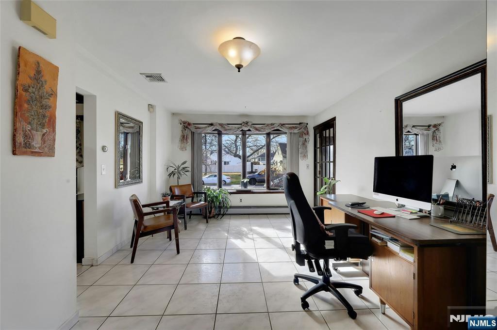 4 Highfield Court Wayne, NJ 07470 - Photo 13 of 49 a workspace with furniture and a chandelier