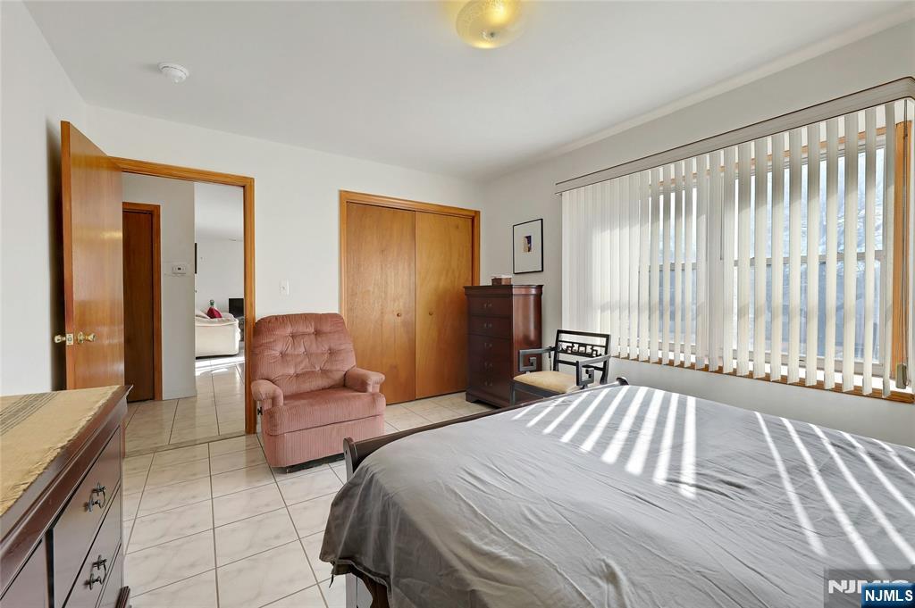 4 Highfield Court Wayne, NJ 07470 - Photo 21 of 49 a bedroom with a bed and a couch