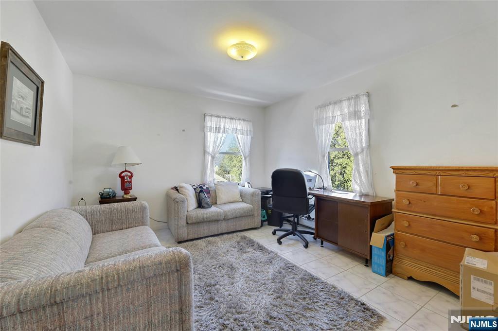 4 Highfield Court Wayne, NJ 07470 - Photo 22 of 49 a living room with furniture and a window