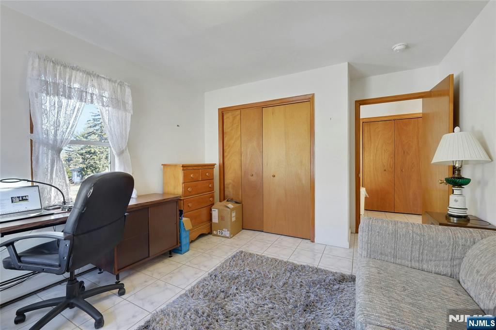 4 Highfield Court Wayne, NJ 07470 - Photo 23 of 49 a view of a workspace with furniture and a window