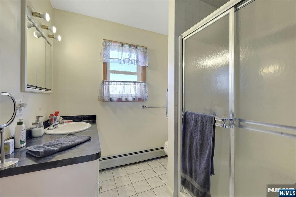 4 Highfield Court Wayne, NJ 07470 - Photo 24 of 49 a kitchen with stainless steel appliances granite countertop a refrigerator and a sink