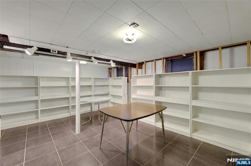 4 Highfield Court Wayne, NJ 07470 - Photo 31 of 49 a room with furniture a rug and a window