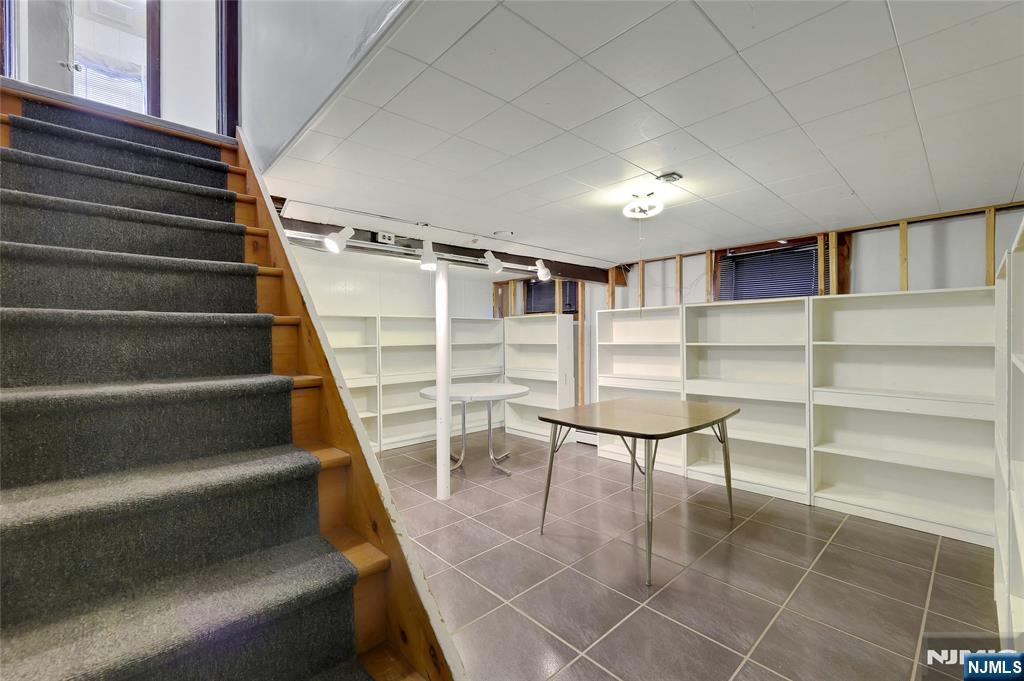 4 Highfield Court Wayne, NJ 07470 - Photo 33 of 49 a view of a room with racks on the wall