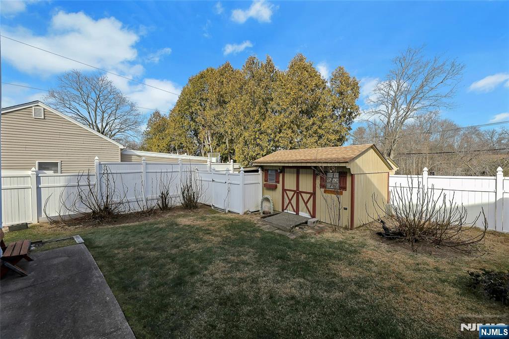 4 Highfield Court Wayne, NJ 07470 - Photo 36 of 49 a front view of a house with a yard