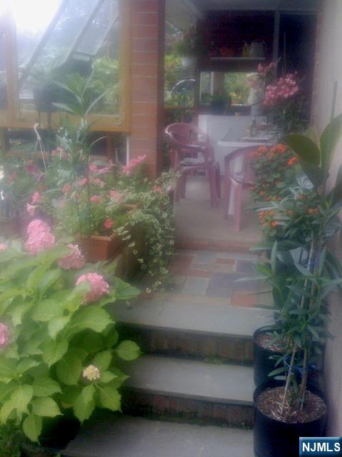 4 Highfield Court Wayne, NJ 07470 - Photo 41 of 49 a backyard of a house with lots of green space