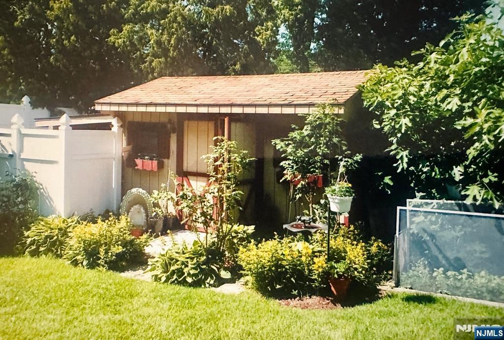 4 Highfield Court Wayne, NJ 07470 - Photo 43 of 49 a view of a house with a flower garden