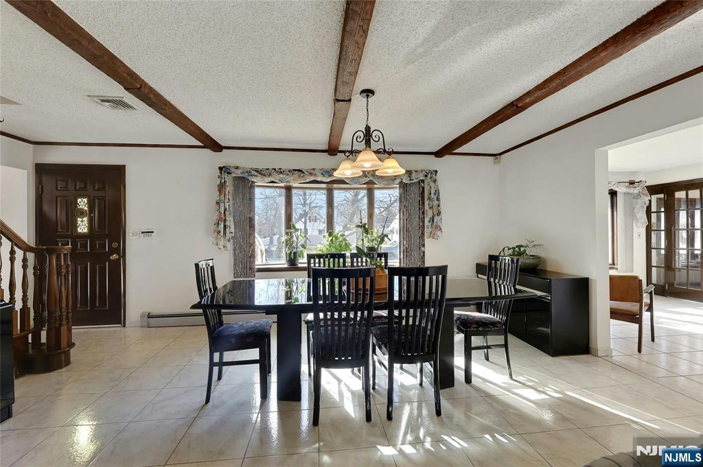 4 Highfield Court Wayne, NJ 07470 - Photo 5 of 49 a view of a dining room with furniture window and wooden floor