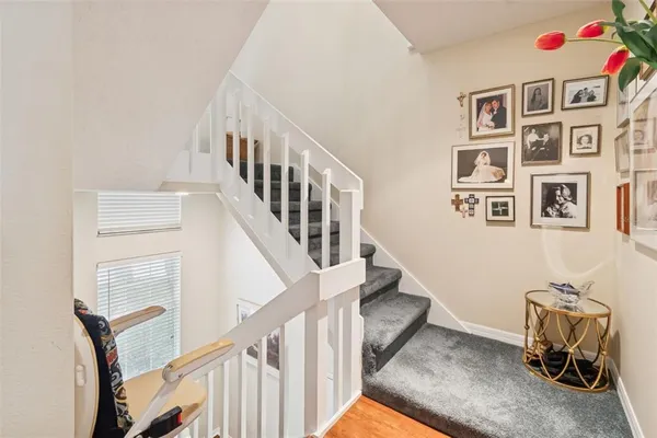 a view of an entryway with wooden floor